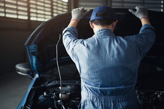 Car Mechanic Opening Car Hood For Internal Checking To Maintenan